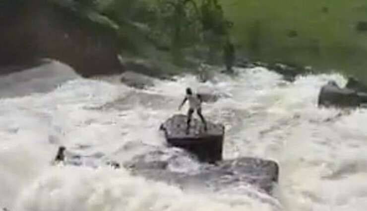 Uomo coraggioso salva il cane dalle rapide di una diga